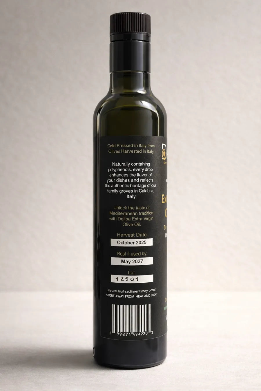 Harvest date olive oil label showing October 2025 and best by date on single origin extra virgin olive oil bottle.