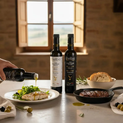 Mediterranean table with fresh salad, bread, and a bottle of extra virgin olive oil